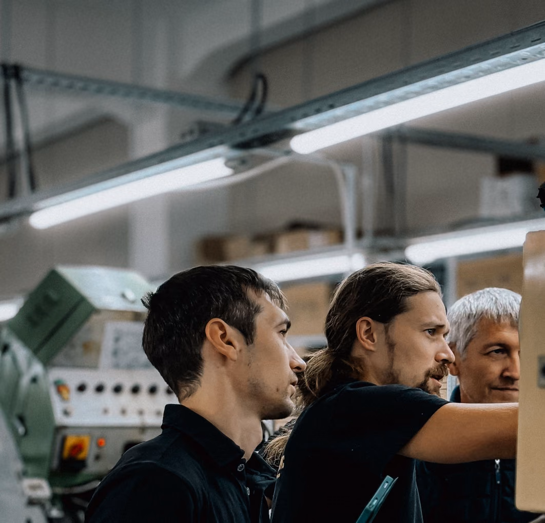 Automobile industry supervisor overseeing an assembly line